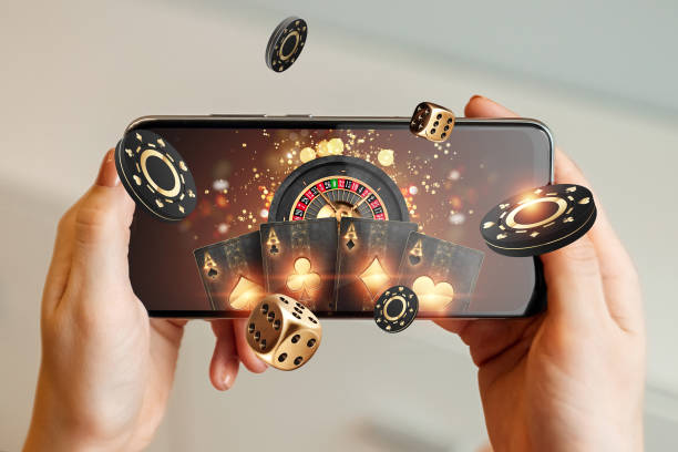 creative background online casino in a mans hand a smartphone with playing cards roulette and - Play88 Review – Everything You Need to Know